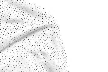 White fabric with small black dots, draped