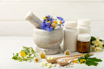 Alternative medicine herbal capsule organic drug on wooden background.Assortment of herbal and...