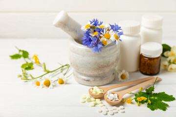 Alternative medicine herbal capsule organic drug on wooden background.Assortment of herbal and...