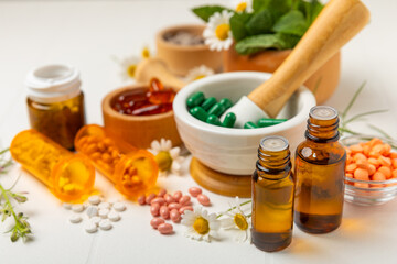 Alternative medicine herbal capsule organic drug on wooden background.Assortment of herbal and tablets,vitamins and dietary supplements.medicinal and Healing herbs.natural supplements for healthy life