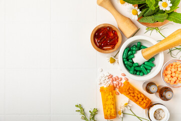 Alternative medicine herbal capsule organic drug on wooden background.Assortment of herbal and...