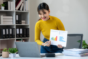 Businesswoman Presenting Financial Data with Laptop