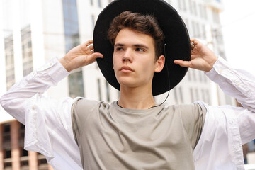 portrait of a trendy young man in the city
