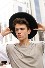 portrait of a trendy young man in the city