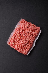 Raw ground beef or pork as an ingredient for burgers. Raw minced meat