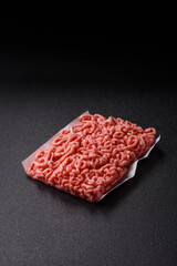 Raw ground beef or pork as an ingredient for burgers. Raw minced meat