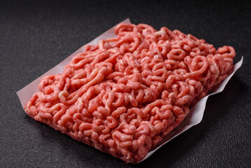 Raw ground beef or pork as an ingredient for burgers. Raw minced meat