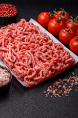 Raw ground beef or pork as an ingredient for burgers. Raw minced meat