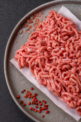 Raw ground beef or pork as an ingredient for burgers. Raw minced meat