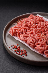 Raw ground beef or pork as an ingredient for burgers. Raw minced meat