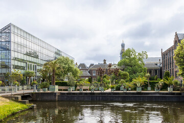 Main glass house and pond at Hortus botanicus Leiden downtown city Leiden in The Netherlands