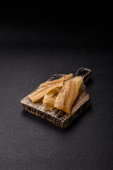 Dried salted fish, snacks or jerky, slices of white fish fillets