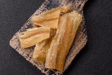Dried salted fish, snacks or jerky, slices of white fish fillets
