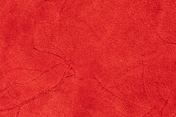 Red leather background or texture. Closeup of red leather texture.