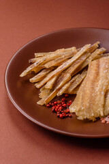 Dried salted fish, snacks or jerky, slices of white fish fillets