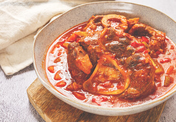 ossobuco, stewed meat knuckle on the bone, with oats and spices, homemade, no people,