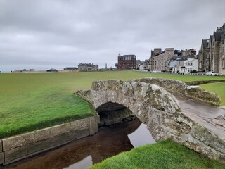 Swilken Bridge and Burn, St. Andrews golf course - Scotland. Looking towards the skyline of St....