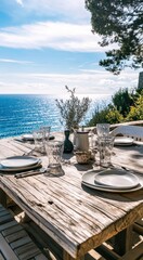 Obraz premium Outdoor dining table overlooking ocean. Rustic wooden table set for a meal with glassware and plates. Coastal scenery