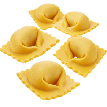 Close up of five yellow tortelloni pasta pieces on a plain white background