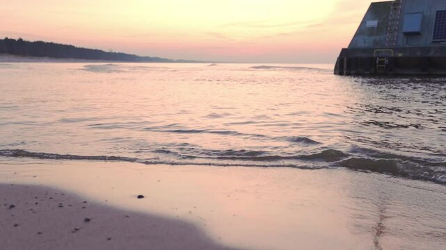 Peaceful winter sunset at the Baltic Sea in Łazy, Poland. 