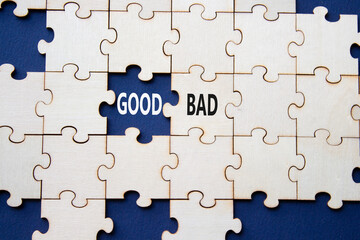 Fototapeta premium Good or Bad symbol. Concept word Good or Bad on wooden puzzle. Beautiful deep blue background. Business and Good or Bad concept. Copy space
