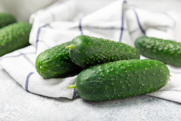 Cucumber on wooden background. Slice of cucumber on background. Fresh organic green cucumbers gherkin. Vegan. Salad ingredient. Farm vegetables. Cut vegetables with knife. Space for text. Copy space