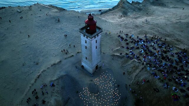 Aerial view of the giant sand dunes with the famous lighthouse on the top of a hill. Rubjerg Knude Lighthouse, , North SeaRubjerg , Sunset at the lighthouse Rubjerg Knude Fyr near Lokken in Denmark. 