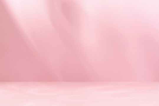 Minimalistic abstract gentle light pink background for product presentation with aesthetic light and shadows