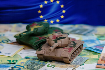 The EU, Money and the Army. Miniature tanks on euro banknotes in the context of the European...