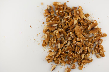 This inviting close-up captures a pile of fresh walnut halves and pieces, exuding a sense of natural goodness and healthy indulgence. Perfect for baking, healthy snacking, or superfood content