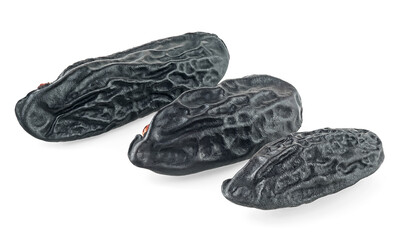 Dried tonka beans isolated on a white background. Beans of Dipteryx odorata.