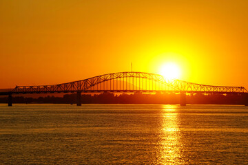 Golden hour sunset on Columbia River in Tri-Cities Washington with bridge