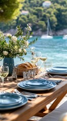 Fototapeta premium Outdoor dining table set on a beach. Coastal scenery in the background. Tableware, flowers, and food are beautifully arranged