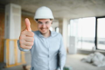 Businessman standing in building in construction process
