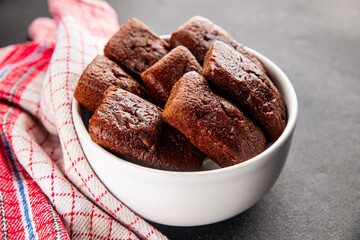 Financier biscuit chocolate cookie sweet dessert fresh delicious gourmet food background on the table rustic food top view copy space