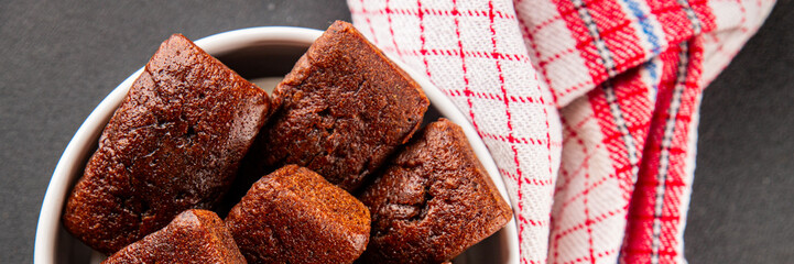 Financier biscuit chocolate cookie sweet dessert fresh delicious gourmet food background on the table rustic food top view copy space