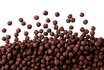 tasty chocolate corn balls scattered in a white background, top view.