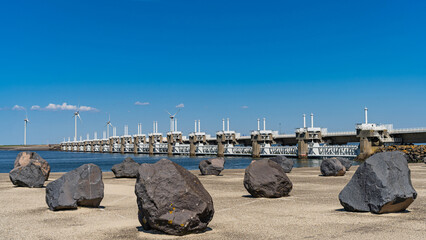Granite blocks in front of the Oosterschelde storm surge barrier (Osterscheldekering) in Vrouwenpolder, province of Zeeland, The Netherlands