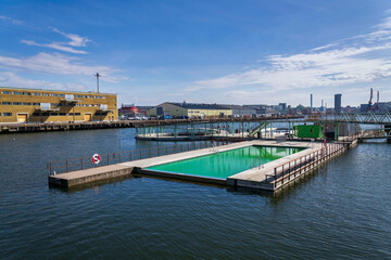 Floating swimming pools with sauna at Allmanna harbour bath in Frihamnen, Gothenburg, Sweden, sunny day