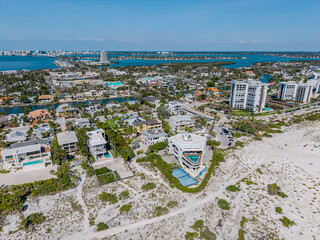 Beautiful aerial view of Sarasota, the magnificent white sand beach, and its iconic St. Armands Circle