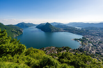 Lugano, Switzerland - Aerial view of the beautiful city of Lugano, showcasing Lake Lugano, surrounding mountains, and the stunning Swiss landscapes.