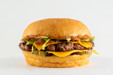 A catalog of burgers in different varieties with potato buns, meat and vegan medallions with lettuce, tomato, bacon, cucumbers, cheddar cheese, and American-style caramelized onions.