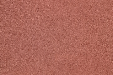 red pink peach Coral stucco wall exterior texture, peach fuzz color background. Abstract artistic backdrop for design. Salmon color, pastel orange plaster, pattern.
