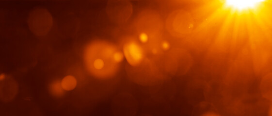 Sun rays with bokeh on orange sky background. Modern summer picture with a sunburst sunbeams. Bright sunny vector illustration. Abstract colorful banner template. Dazzling sunshine sun rays with bokeh