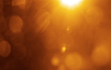 Sun rays with bokeh on orange sky background. Modern summer picture with a sunburst sunbeams. Bright sunny vector illustration. Abstract colorful banner template. Dazzling sunshine sun rays with bokeh