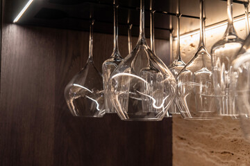 Clear glasses hanging upside down