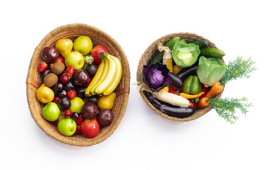 artificial vegetables and fruits in basket isolated on white background