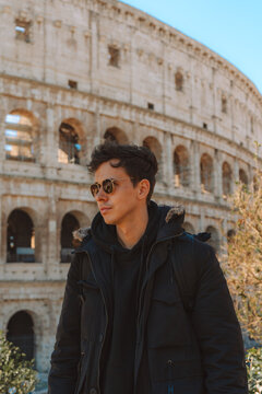 Tourist exploring the colosseum in rome, italy
