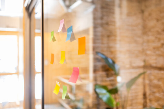 Colorful sticky notes in modern coworking space