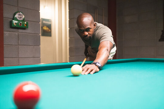 Man playing pool in a modern coworking space